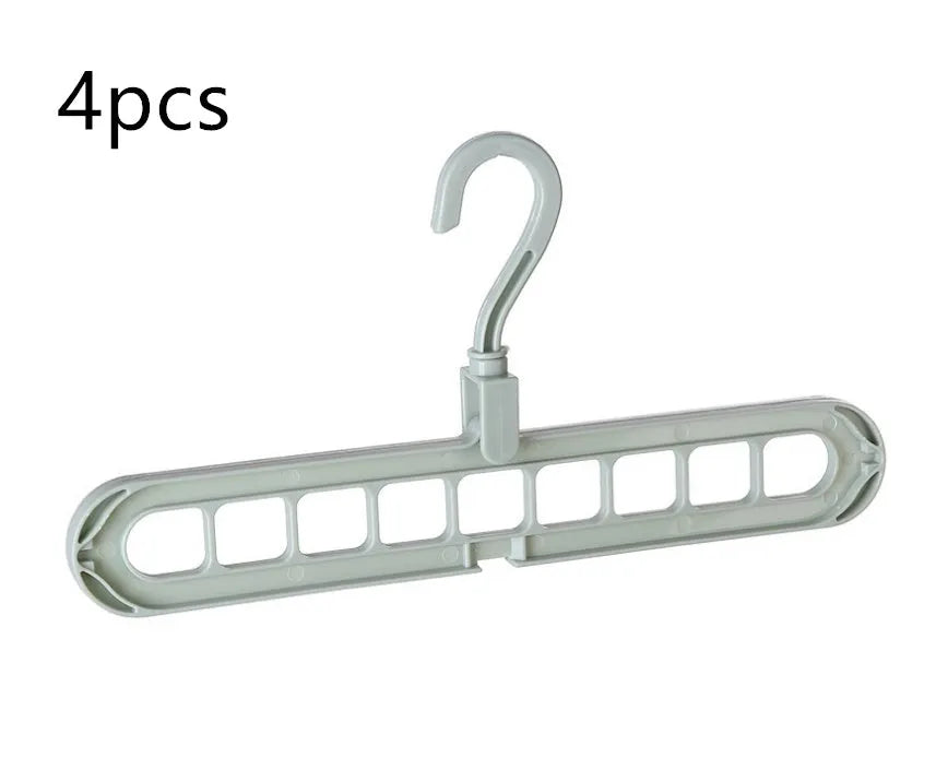 Plastic clothes hanger with rotating hook in assorted colours on white background