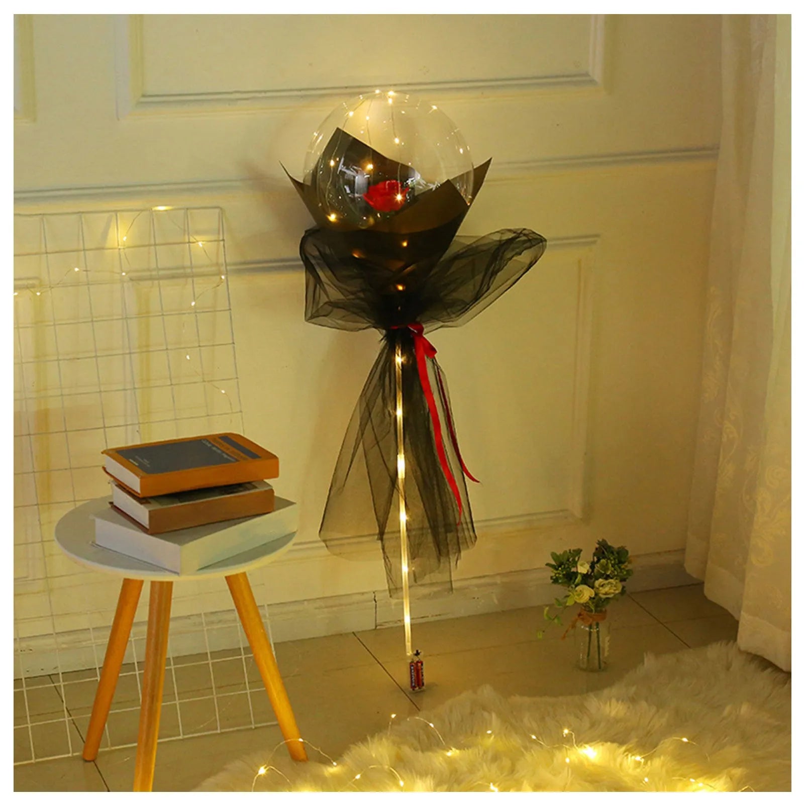 Transparent LED luminous balloon with artificial rose and built-in light, shown as a DIY bouquet kit.