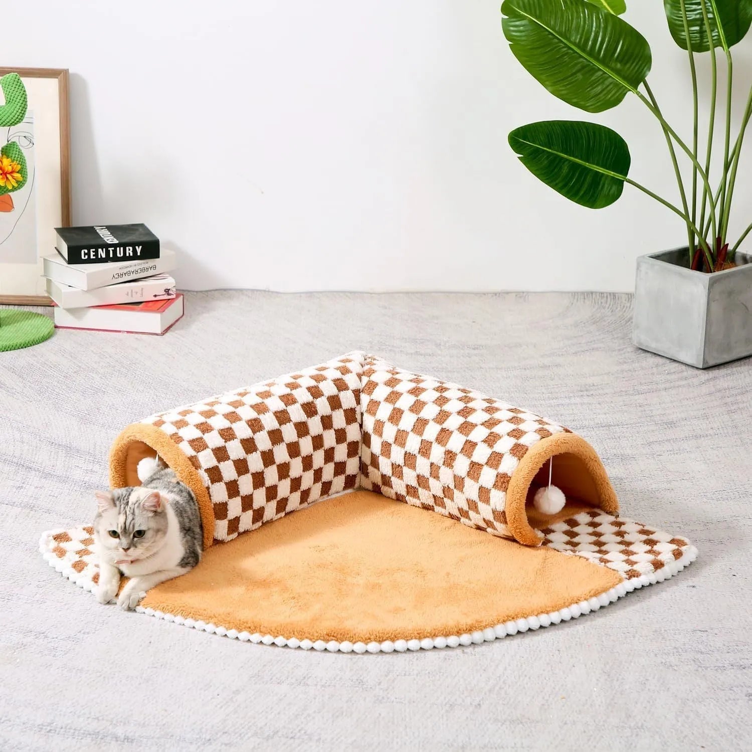 XL coffee coloured plush fan-shaped pet bed with a tunnel for dogs and cats on a wooden floor.