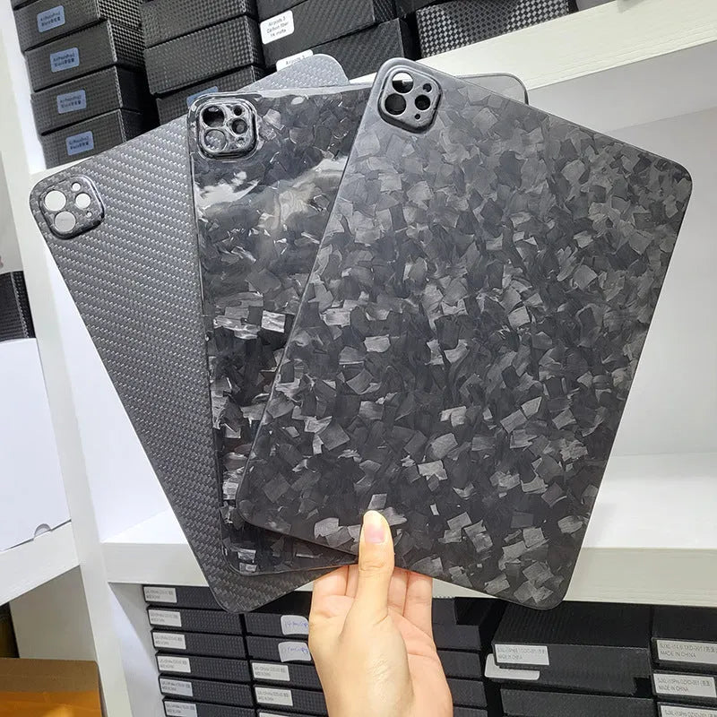 Carbon fibre hard protective case for Apple iPad Pro 11 showing embossed plaid pattern and choice of surface finishes.