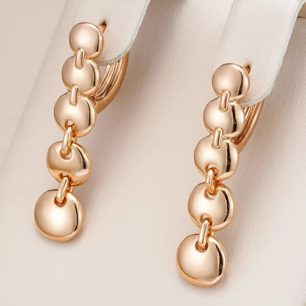 Gold woven copper circle earrings with retro circular design