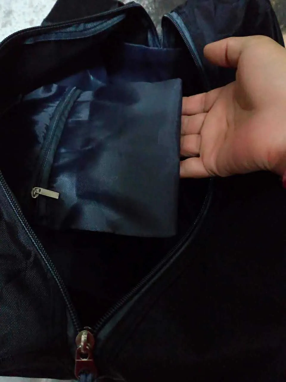Black nylon yoga gym bag showing medium and large size options next to a yoga mat.