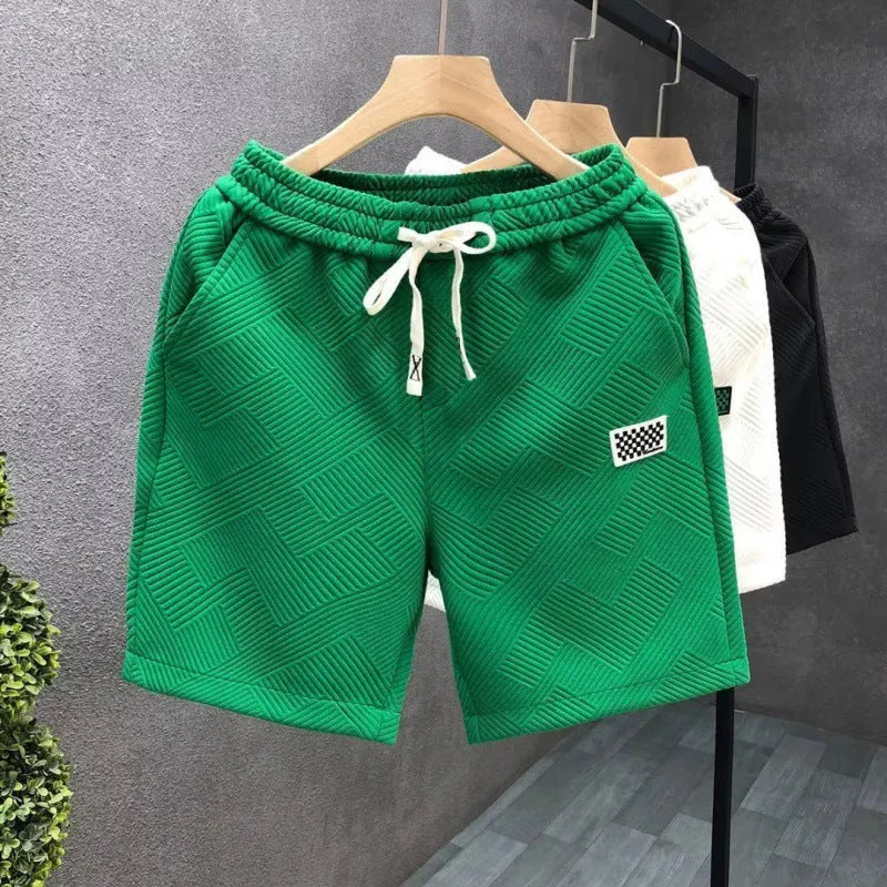 Men's casual polyester sports shorts in solid colours with micro-elastic fabric for beach and sports activities