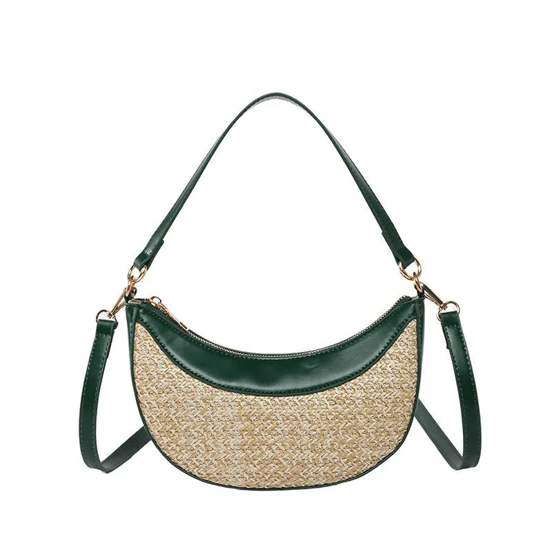 Hard woven straw dumpling-shaped crossbody shoulder bag with organised interior compartments.