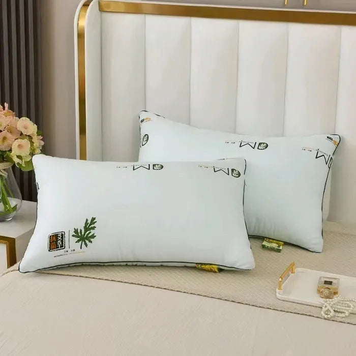 A standard 48x74cm polyester fibre filled pillow in a solid colour, shown on a bed.