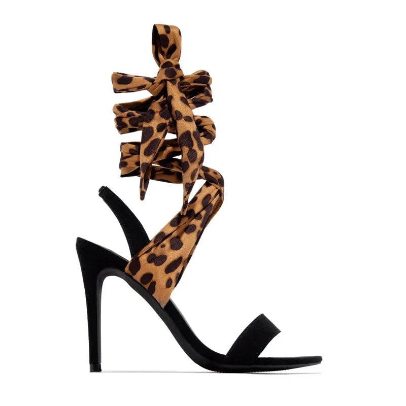 Light brown leopard print Roman style high heels with cross straps and super high heel