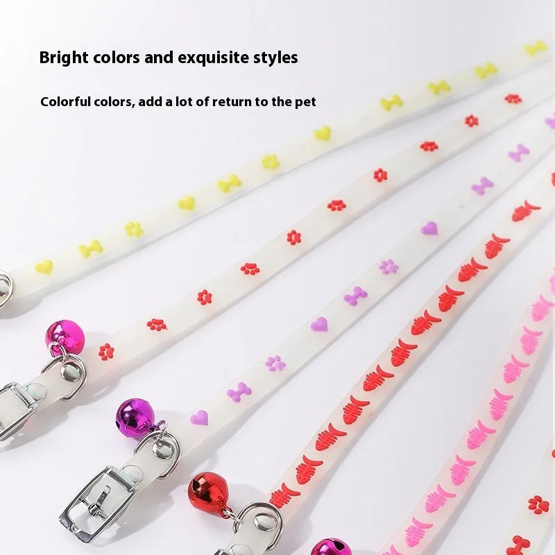 Luminous cat collar with adjustable silicone chain and metal bell in paw print pattern