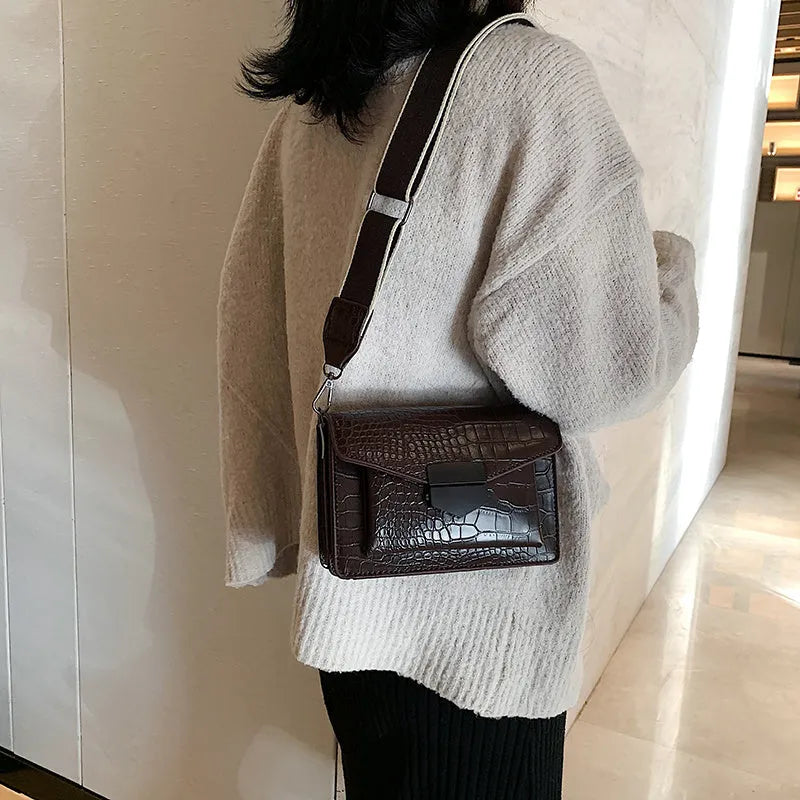 Vintage PU crossbody bag in black, shown with measurements and internal polyester lining