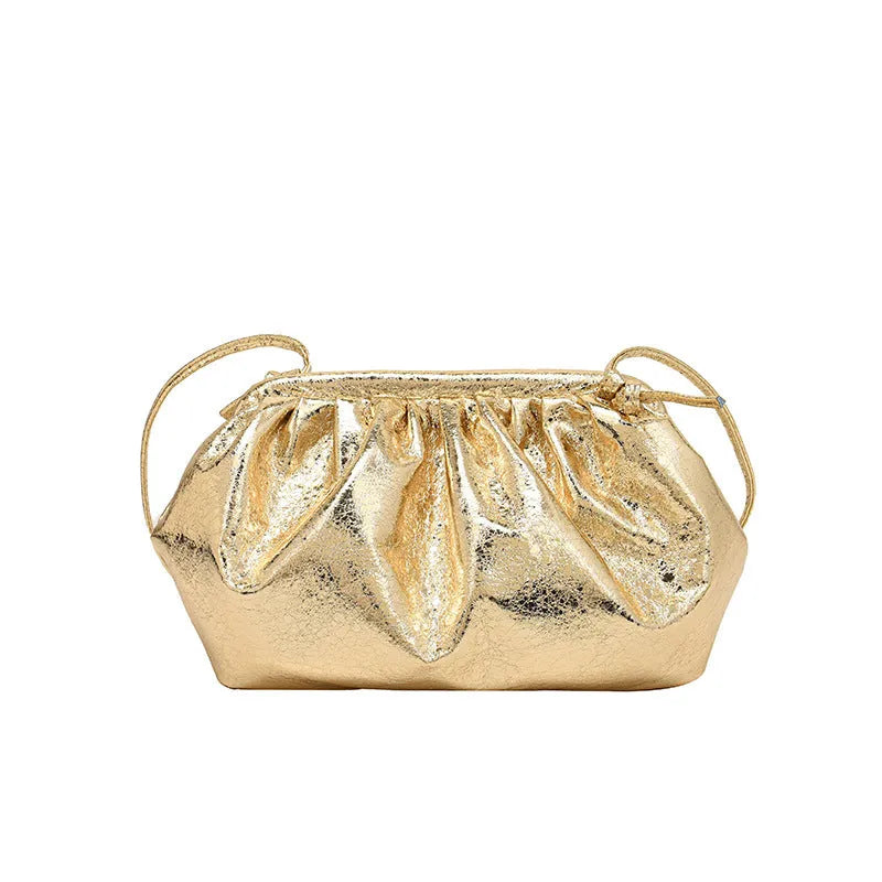 Shell-shaped shoulder crossbody bag with hair clip closure in rose red colour showing interior organisation compartments