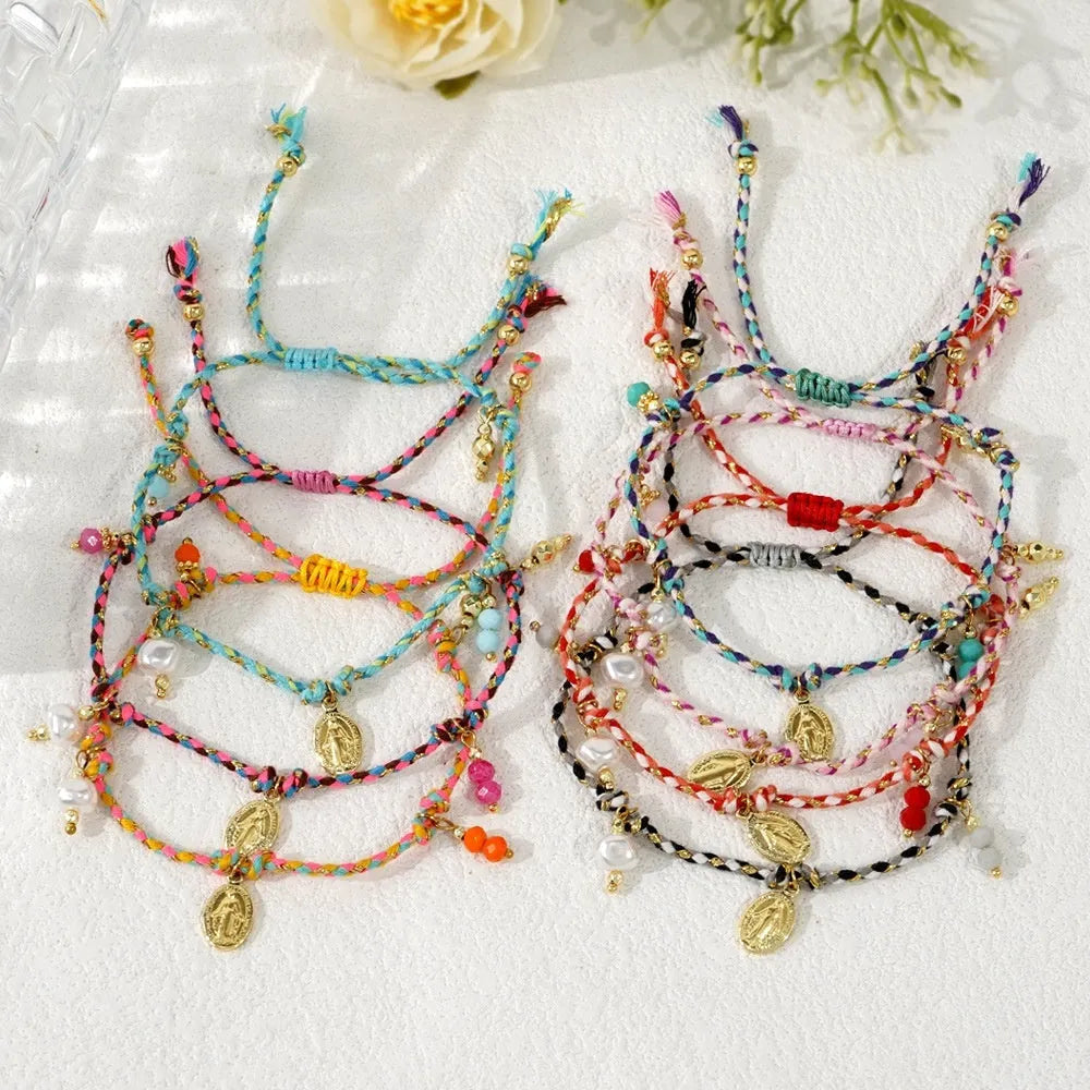 Close-up of a hand-woven colourful braided rope bracelet for women with a carrying strap tag.