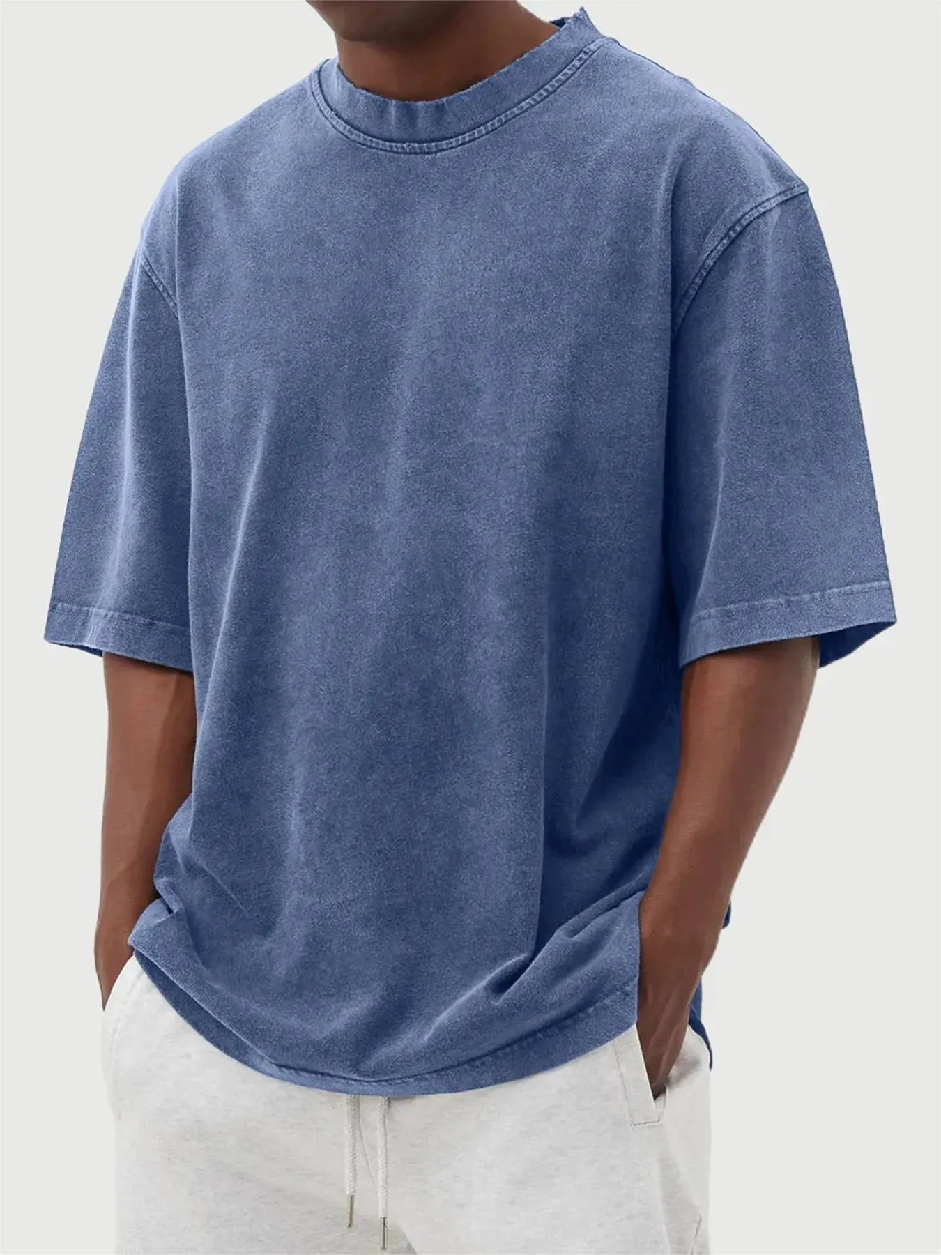 Men's loose fit distressed stone wash pullover t-shirt in solid colours like army green and blue.