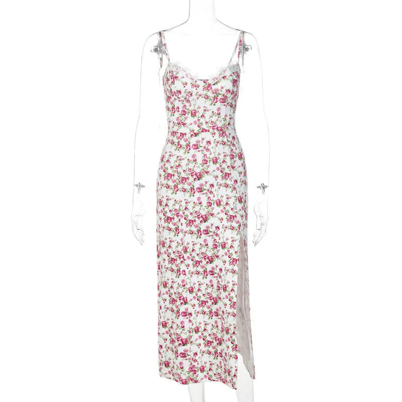 Women's long summer dress with lace flower print, suspender straps, and a high-leg slit.