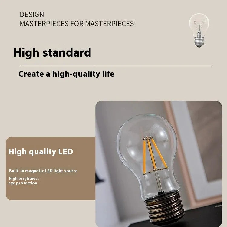 Black suspension bulb night lamp with wooden base on desktop