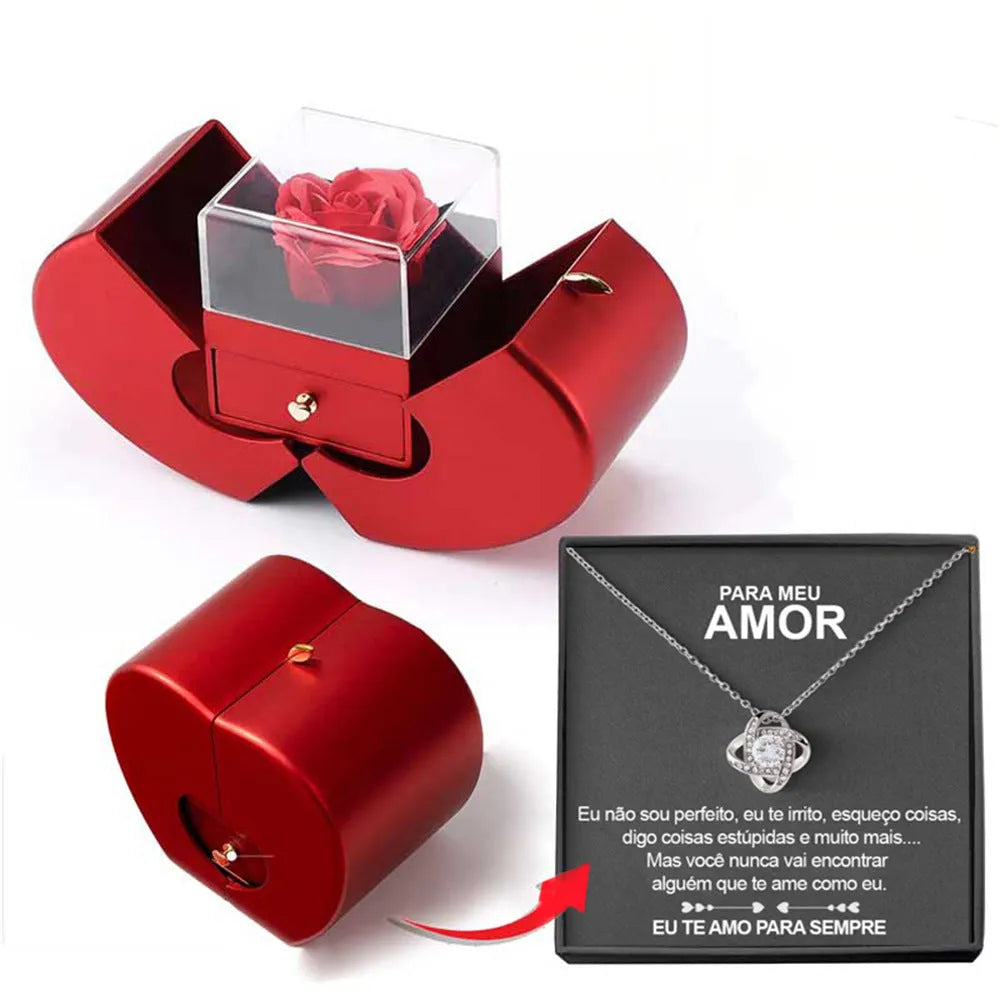 Red apple-shaped jewelry box with eternal soap flower rose and silver necklace inside