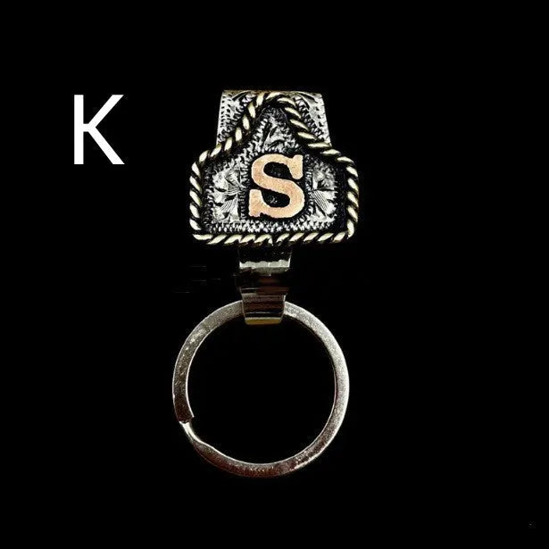 Handmade metal cow tag key holder for belts in assorted colours on a leather strap