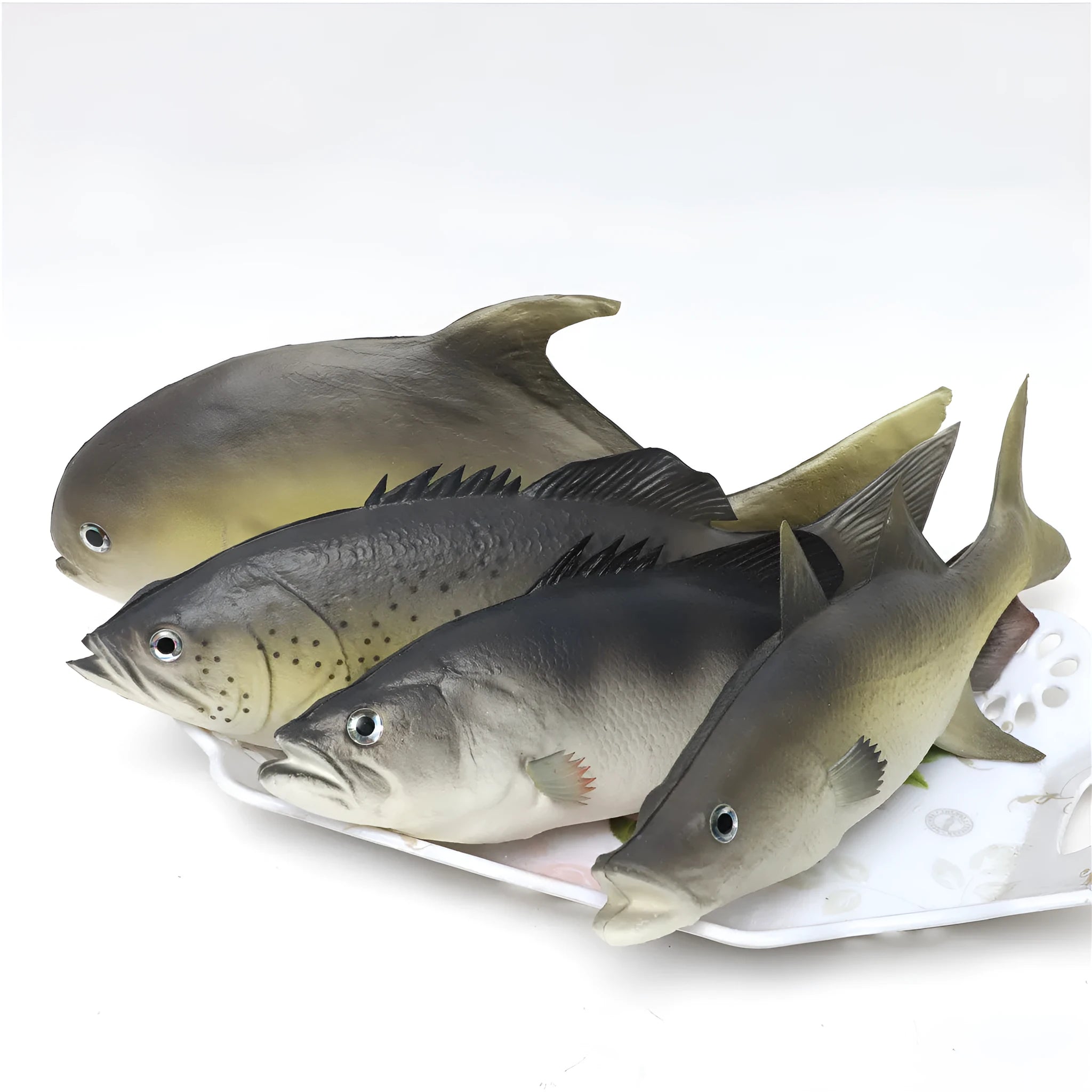 Set of three detailed PU simulated fish models: yellow-fin tuna, small tuna, and yellow croaker on a white background.