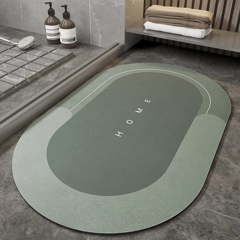 Blended fabric bathroom floor mat in blue colour, shown in an oval shape on a tiled floor.