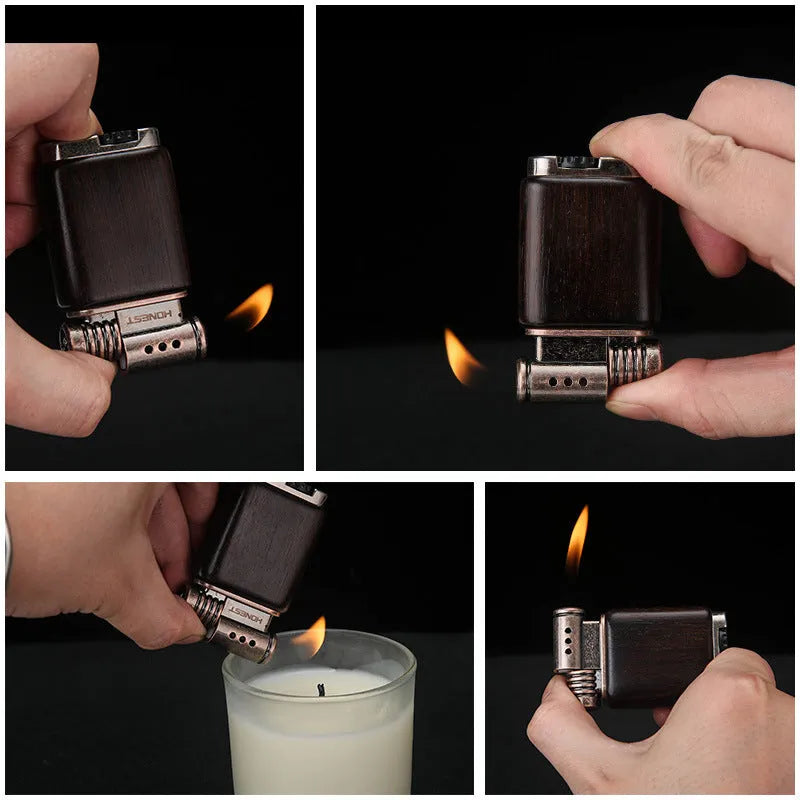 Ebony gas lighter with carved rosewood good luck design on a metal body.