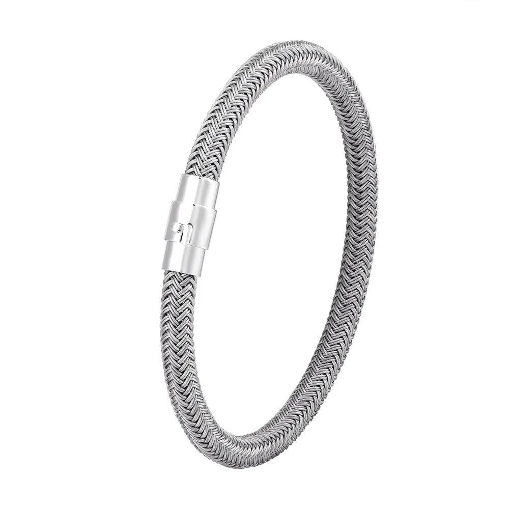 Titanium steel geometric wire bracelet with magnetic clasp on a wrist, showing unisex boyfriend style.