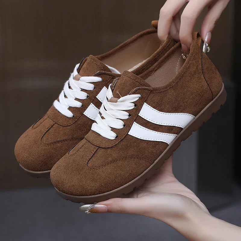 Women's vintage canvas sneakers in dark red with a round toe and soft rubber sole.