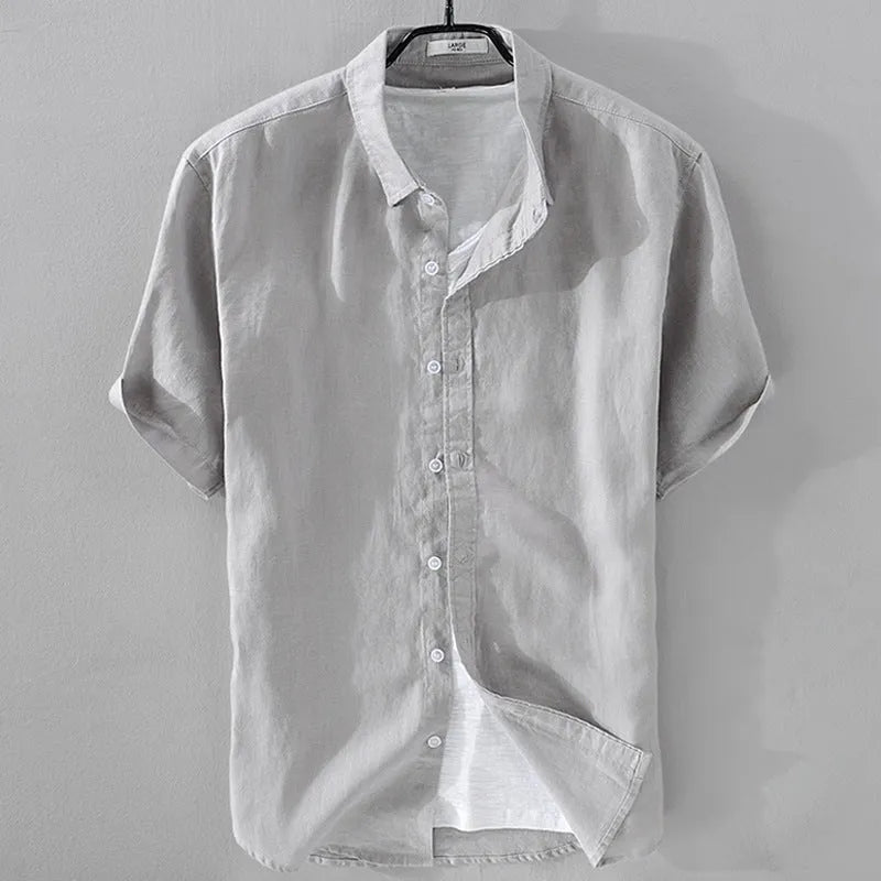 Men's loose fit short sleeve linen shirt in apricot colour on a hanger