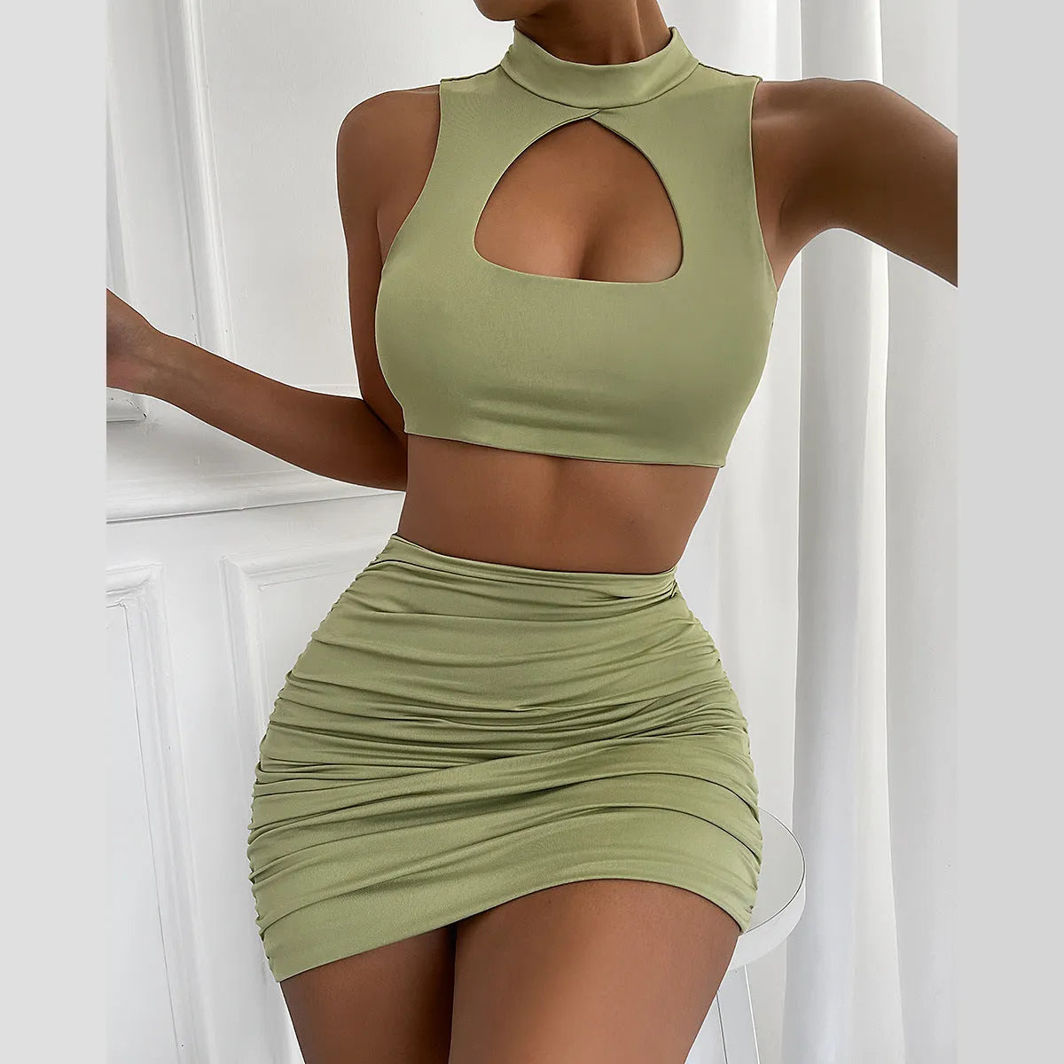 Women's light purple summer two-piece set with hollow vest top and matching hip skirt