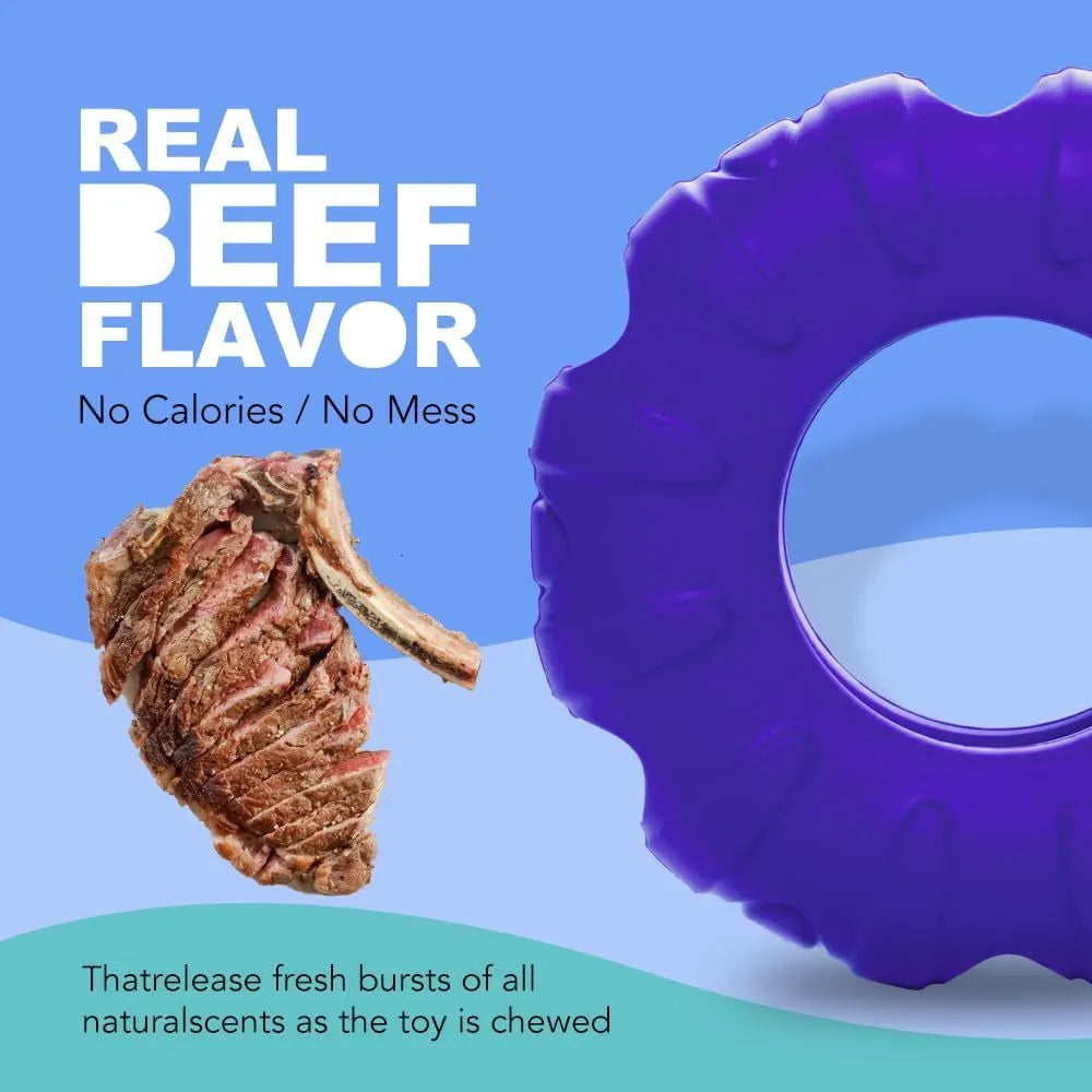 Blue rubber tire-shaped dog chew toy with oval openings, shown as a puzzle feeder for medium to large dogs.