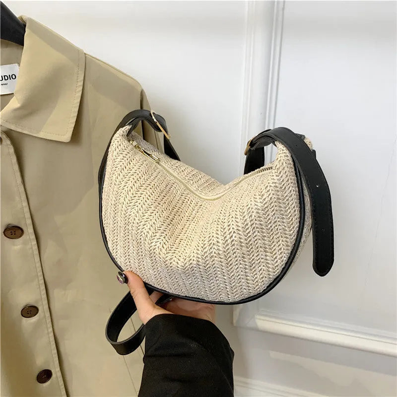 Women's straw woven crossbody bag with internal phone and document pockets in corrugated finish