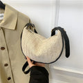 Women's straw woven crossbody bag with internal phone and document pockets in corrugated finish