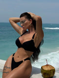 Women's solid black nylon bikini swimsuit set for swimming and wading