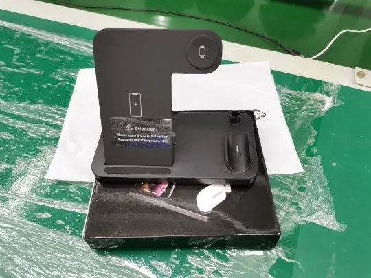Folding 4-in-1 wireless charger in space grey colour showing vertical phone charging and Apple Pen slot