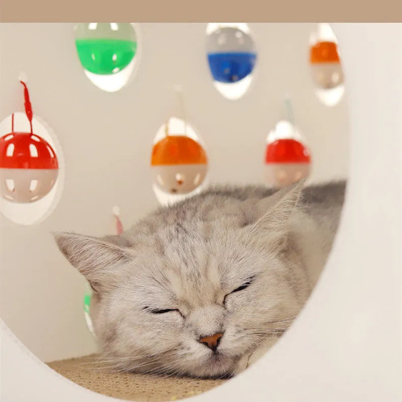 Plastic cat scratch board toy with integrated raised cat nest, tunnel, and bell ball.