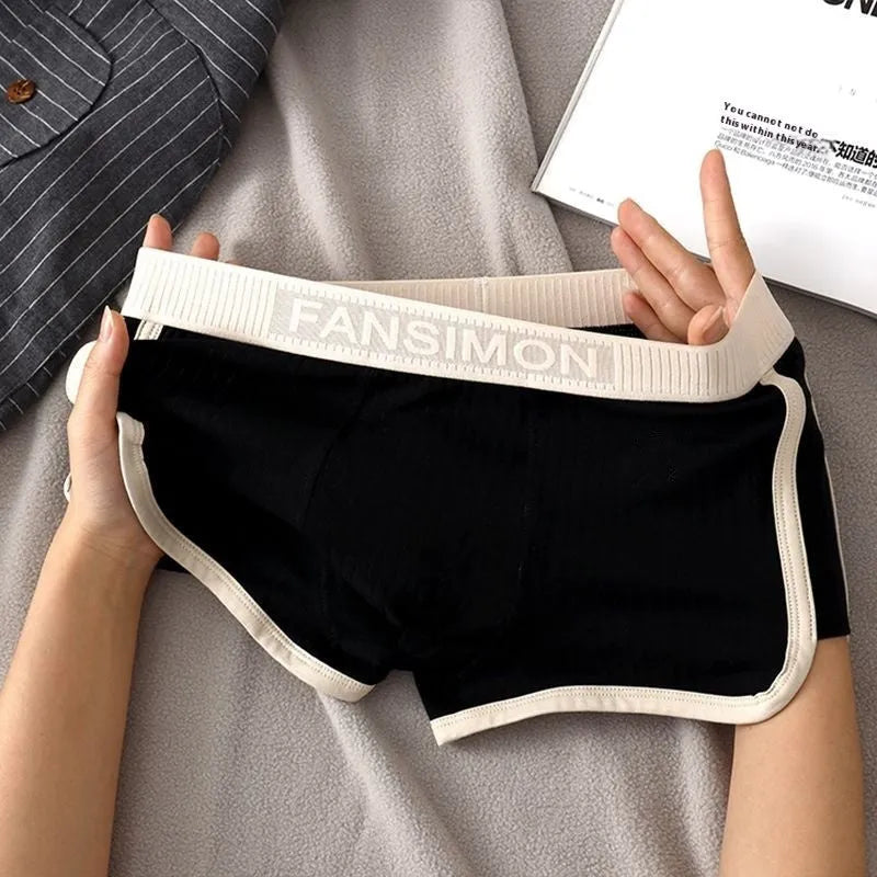 Three-pack of men's milk silk polyester boxer shorts in solid colours on a white background