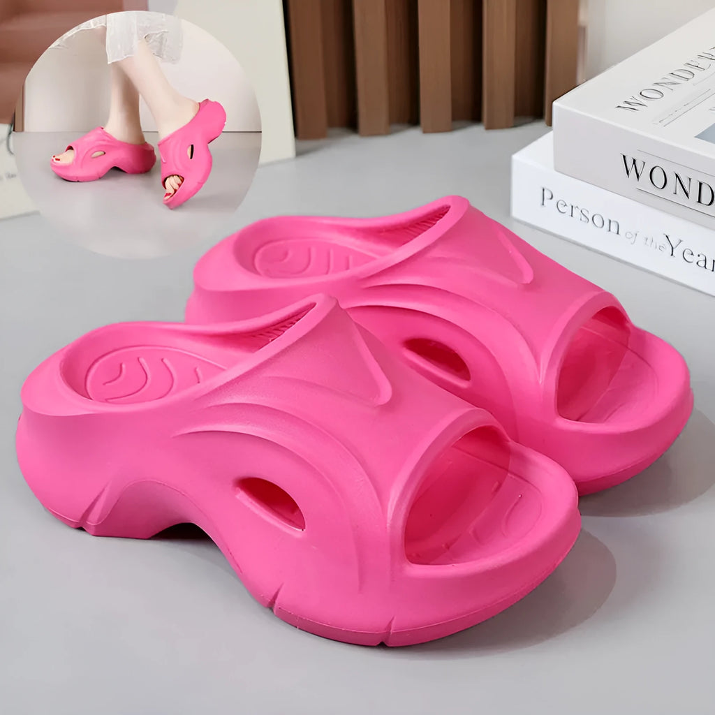 Women's white EVA slippers with thick sole and round toe on a beach background