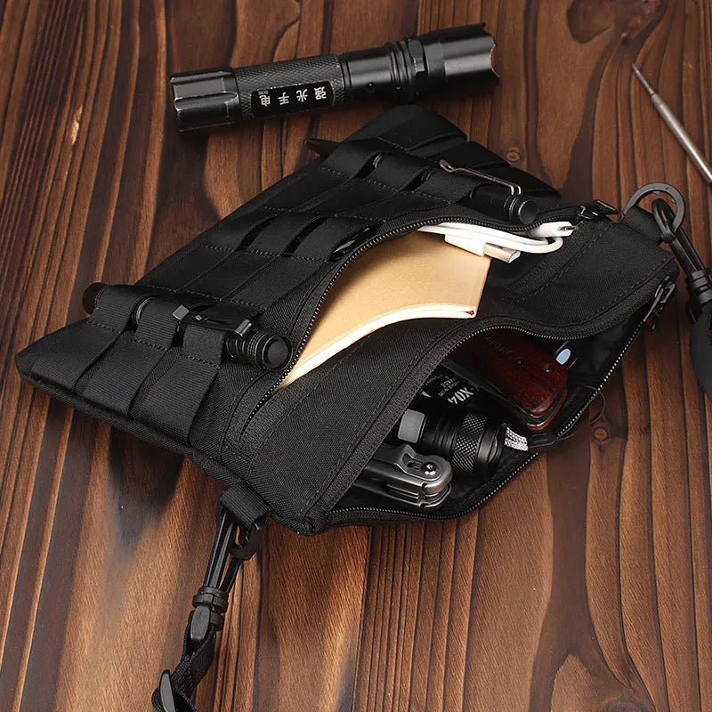 Black Oxford cloth military utility bag measuring 18 by 3.5 centimetres