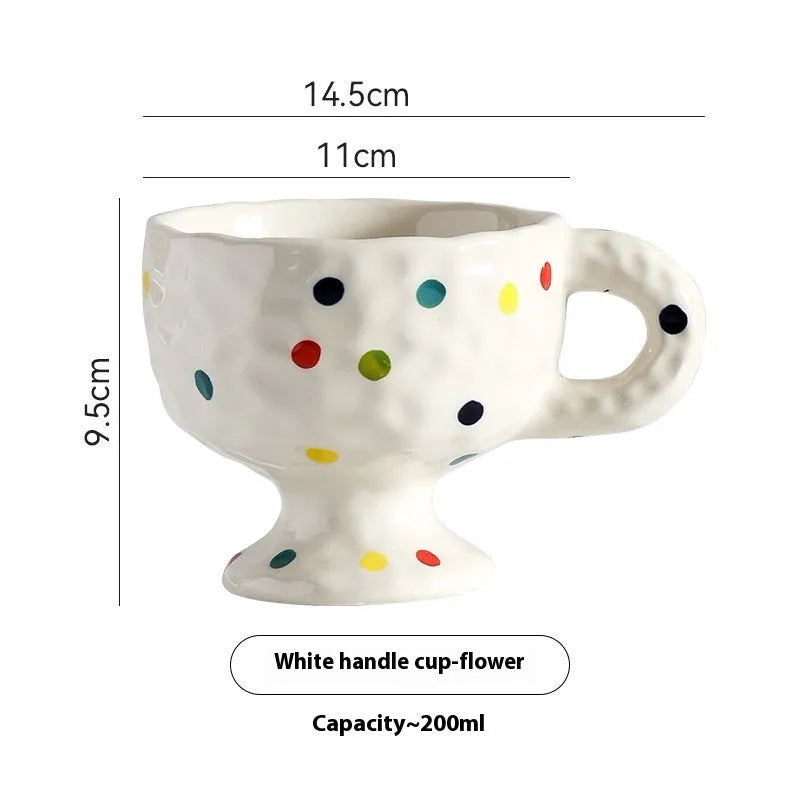Hand-pinched irregular ceramic mug with solid colour design, approximately 14.5cm tall