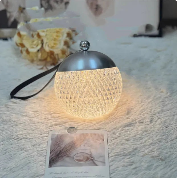 Portable dimmable LED night lamp with touch control in minimalist design, 12cm diameter and height