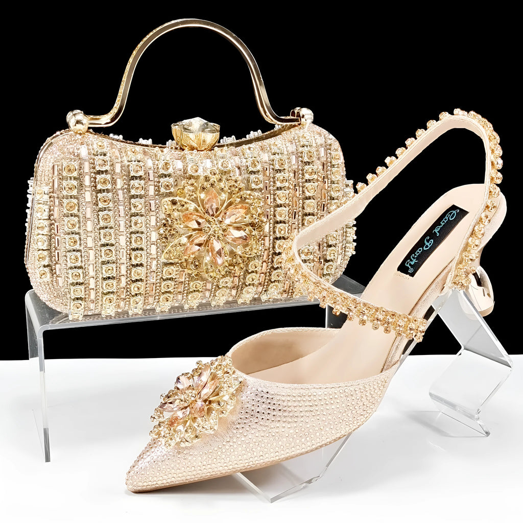Women's black synthetic leather high-heel shoes with rhinestone ankle chain and matching hard clutch bag.