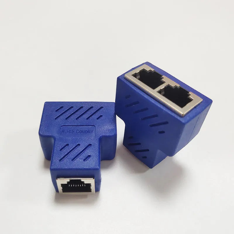 White RJ45 network cable tee splitter adapter on a dark background