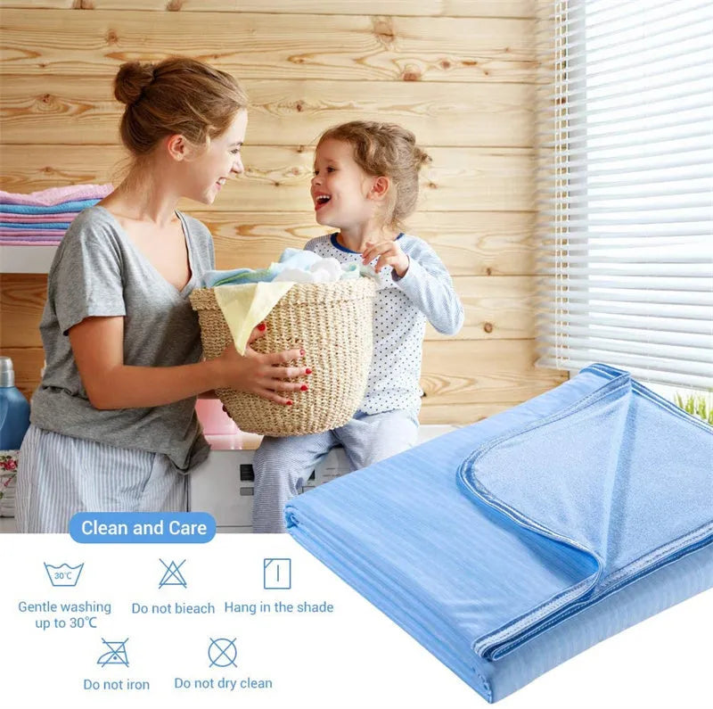 Blue Japanese cooling blanket with Q-Max fibres laid flat on a bed.