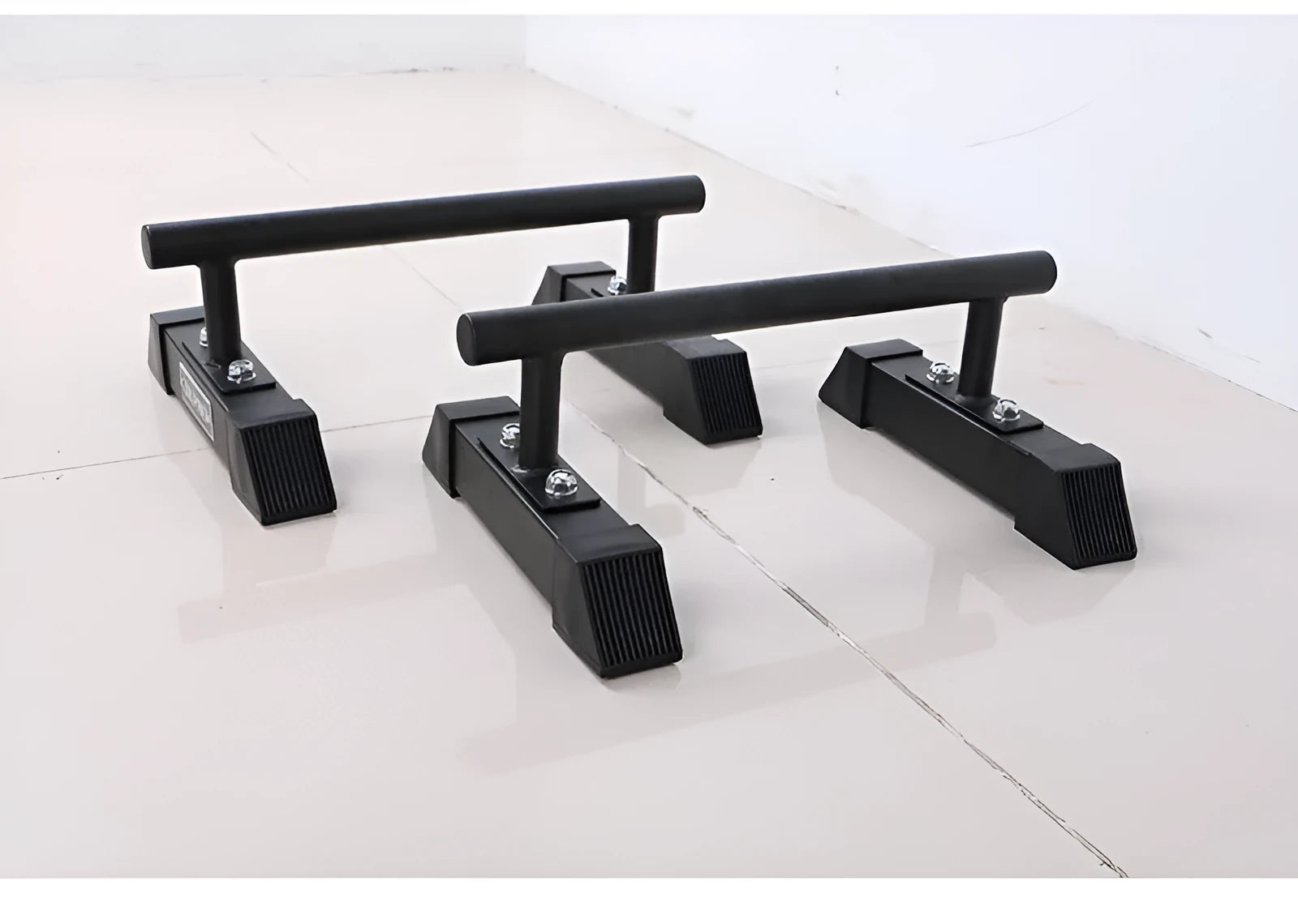 Black thick steel pipe parallel bars for home fitness measuring 35x20x20cm