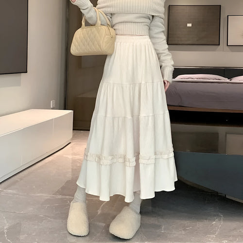 Korean style corduroy A-line midi skirt with elastic waistband in milky white colour on hanger