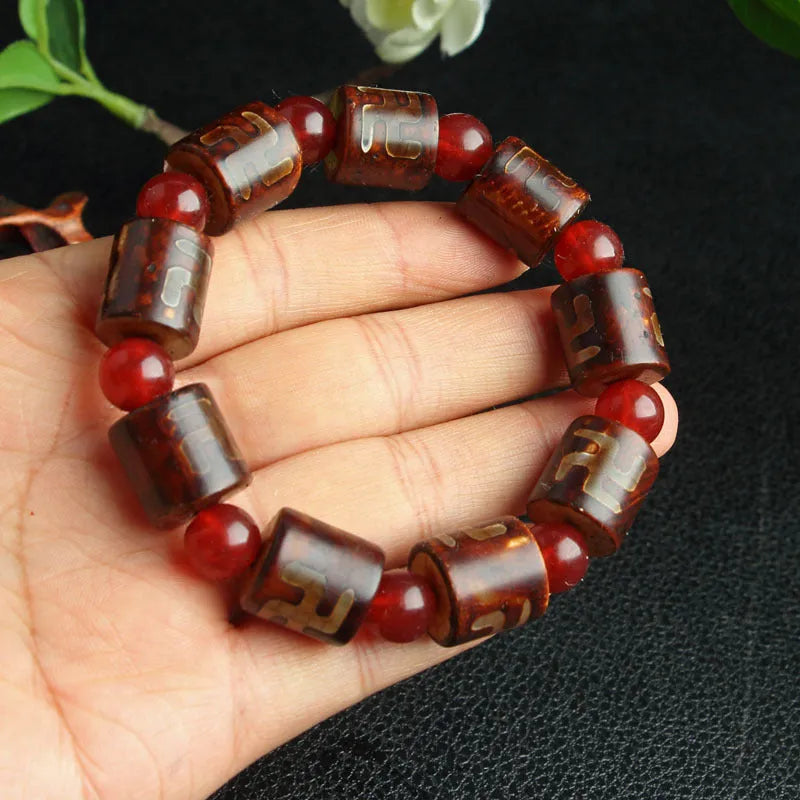 Agate Tibetan dzi bead bracelet with three-eye design and polished finish