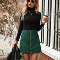 Women's high waist short skirt with front zip closure in black, shown on a hanger