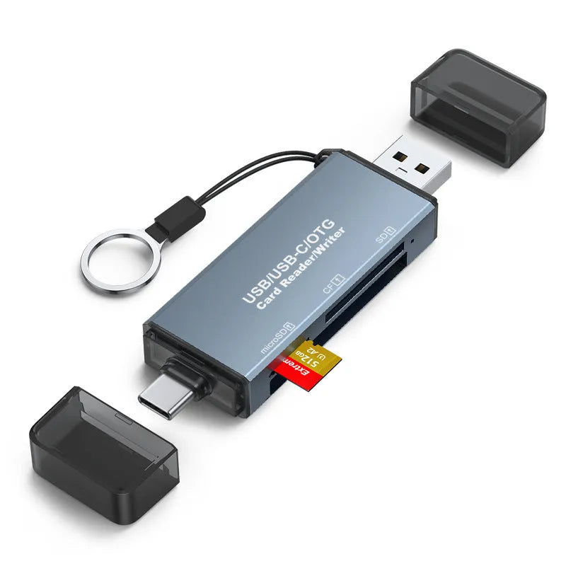 Silver aluminium USB memory card reader for SD, CF, and microSD cards with a USB-C cable.