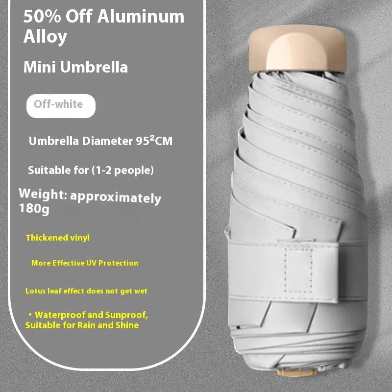 Compact five-fold sun umbrella with a gradient vinyl-laminated canopy and an alloy frame.