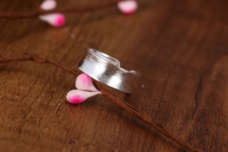 Korean frosted sterling silver geometric open ring with adjustable size on display