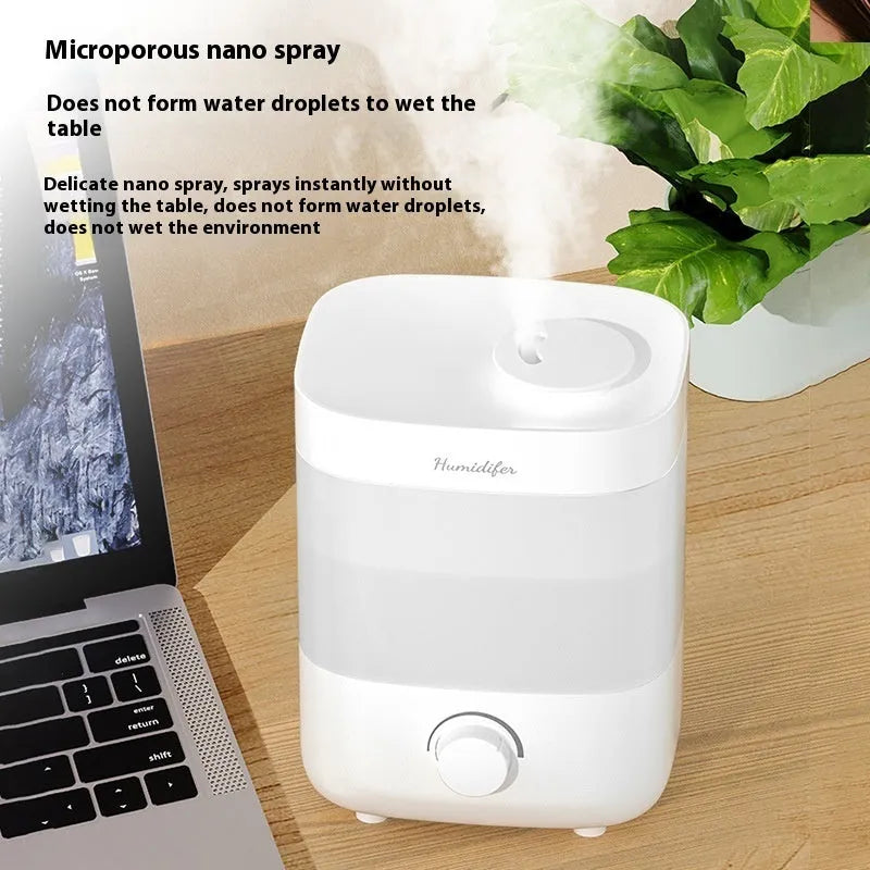 2L white plastic USB humidifier with dual spouts and night light on a desk
