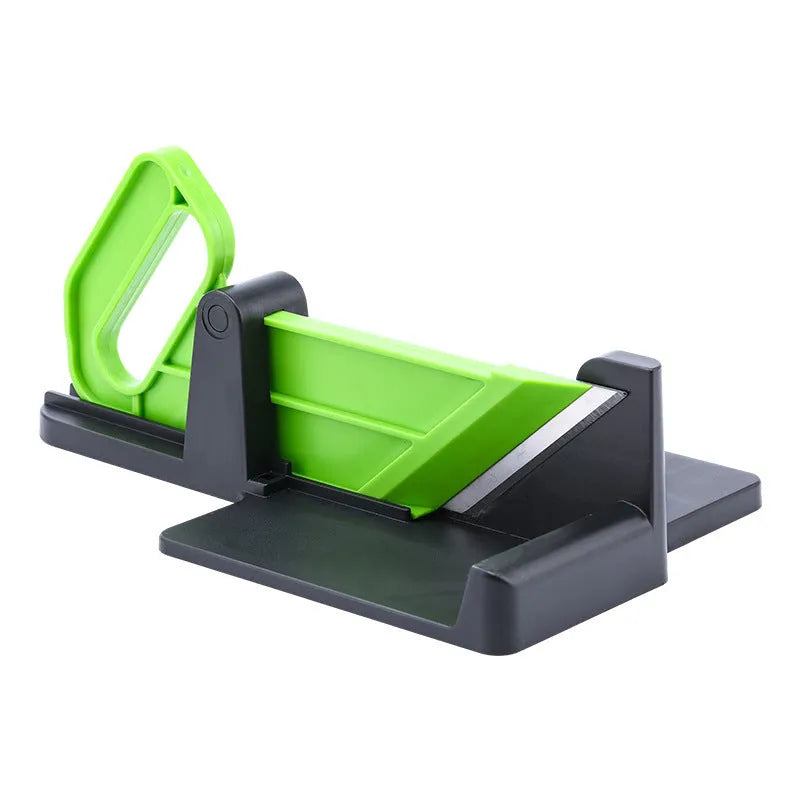 Green plastic vegetable cutter with stainless steel blades for cutting carrots and potatoes