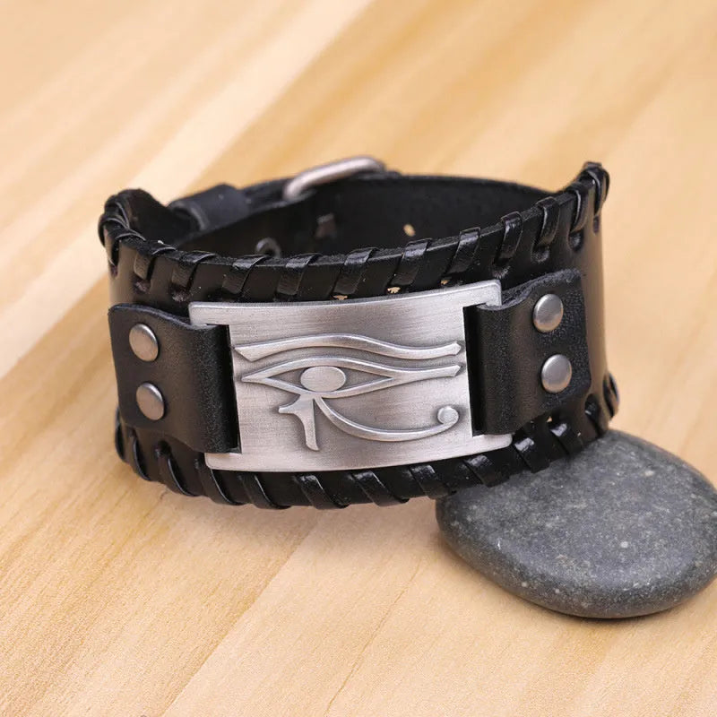 Leather bracelet with round alloy accents in ancient bronze finish on a neutral background